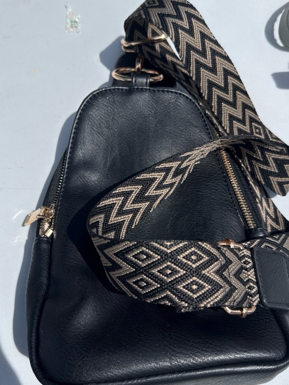 Black Leather Crossbody Sling Bag with Patterned Strap